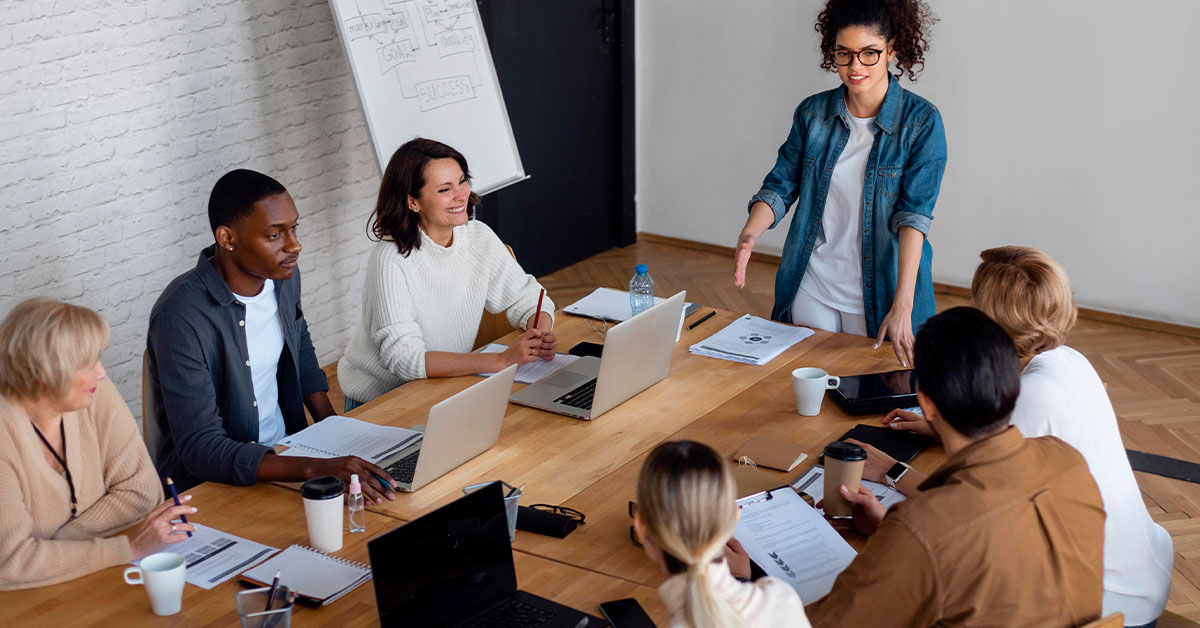 Colleagues meeting around a boardroom table