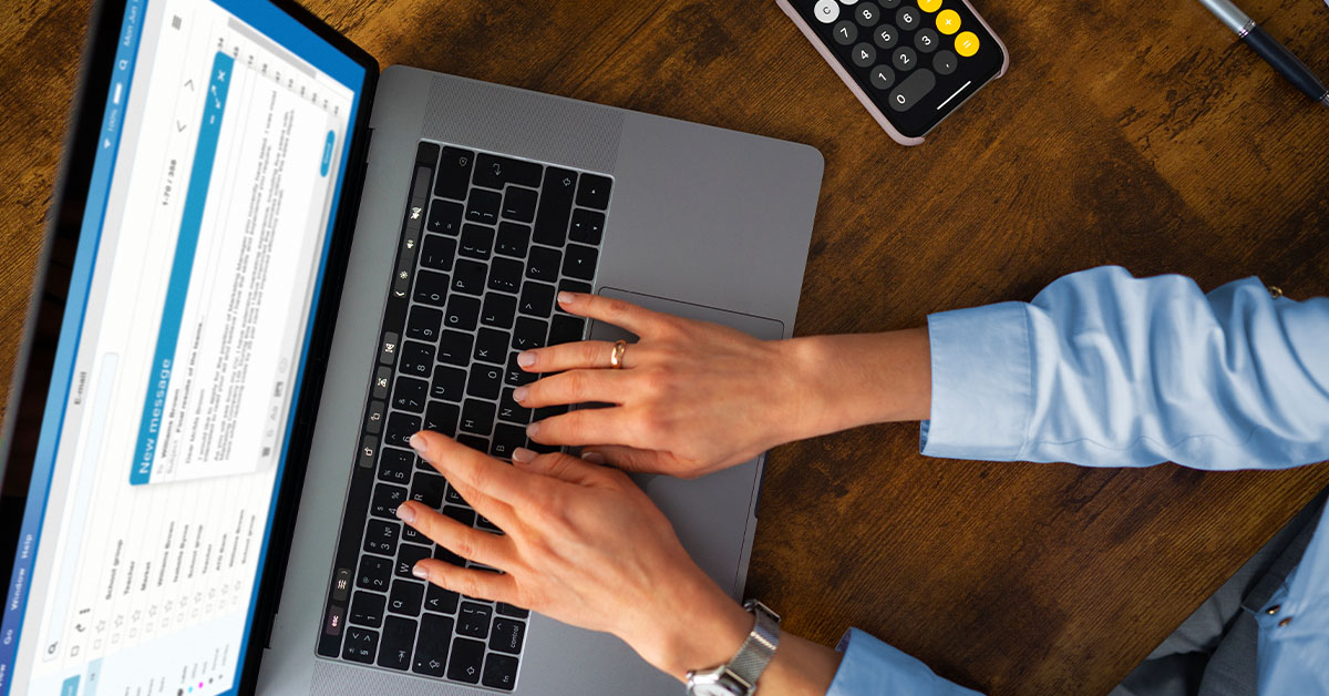 Women typing on a laptop